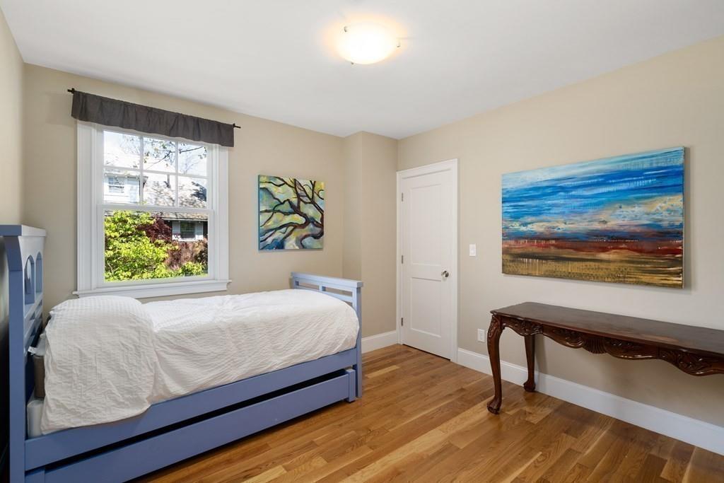 12 Vineyard Road Newton, MA 02459 - Photo 19 of 26 a bedroom with a bed and a painting on the wall