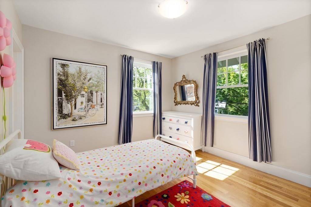 12 Vineyard Road Newton, MA 02459 - Photo 20 of 26 a bedroom with a bed and a dresser next to a window