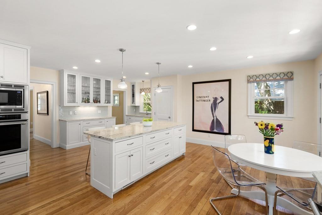 12 Vineyard Road Newton, MA 02459 - Photo 7 of 26 a large kitchen with stainless steel appliances kitchen island granite countertop a sink and cabinets