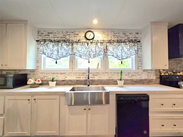 a kitchen with a stove and a sink