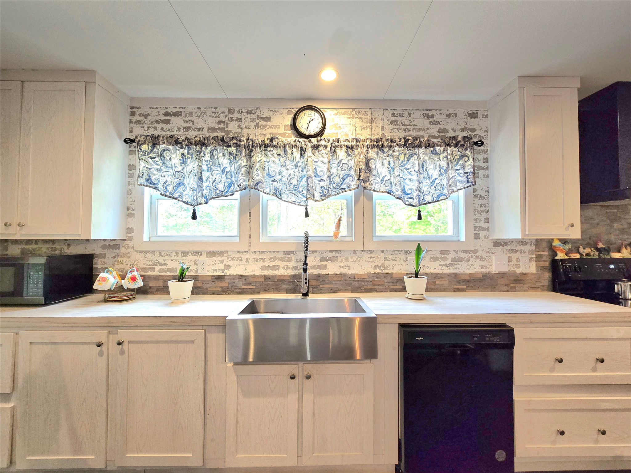 223 County Road 2167B Cleveland, TX 77327 - Photo 11 of 50 a kitchen with a sink cabinets and window