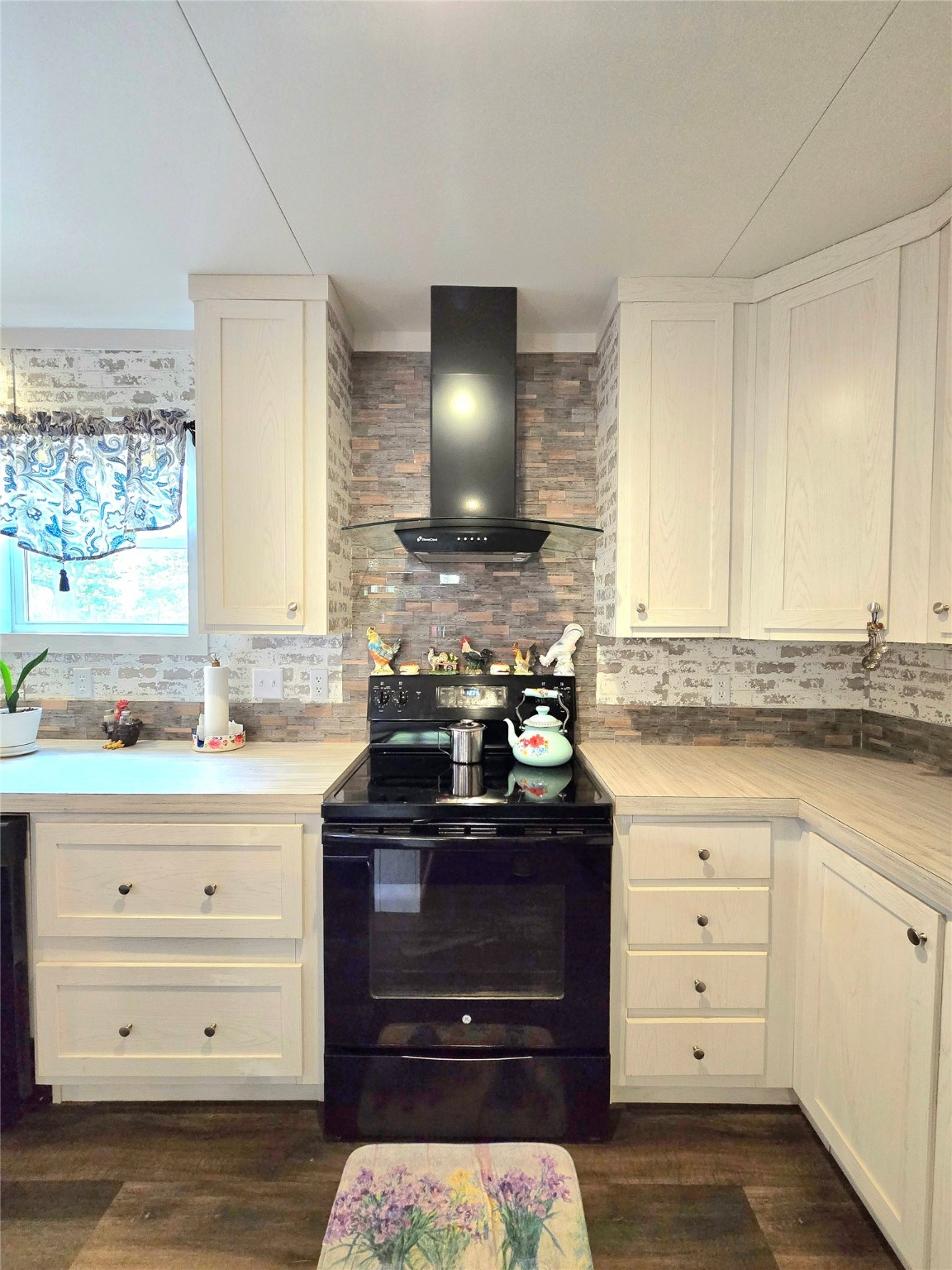 223 County Road 2167B Cleveland, TX 77327 - Photo 12 of 50 a kitchen with a stove and a sink