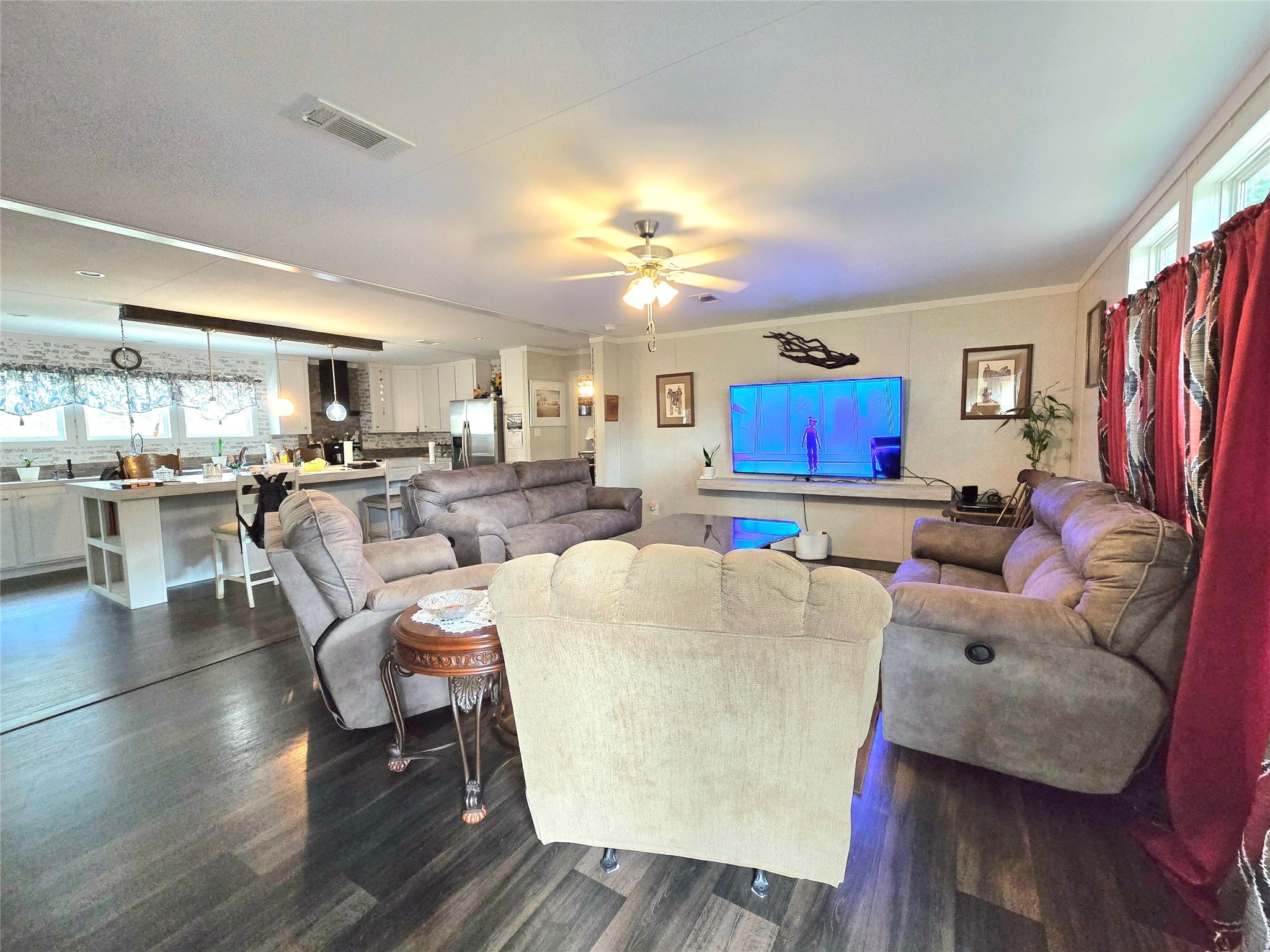223 County Road 2167B Cleveland, TX 77327 - Photo 14 of 50 a living room with furniture kitchen view and a large window