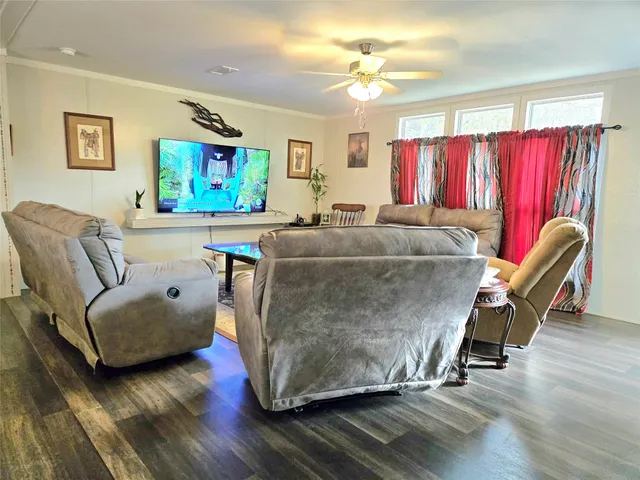 a living room with furniture and a rug