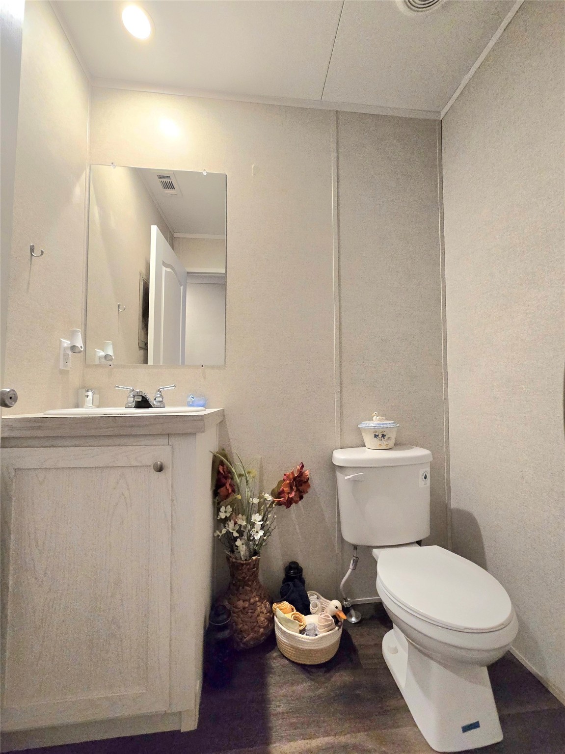 223 County Road 2167B Cleveland, TX 77327 - Photo 28 of 50 a bathroom with a sink toilet and mirror