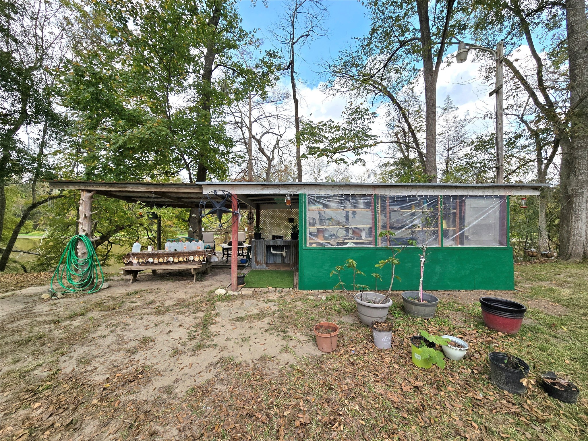 223 County Road 2167B Cleveland, TX 77327 - Photo 34 of 50 a view of a yard with furniture and a garden