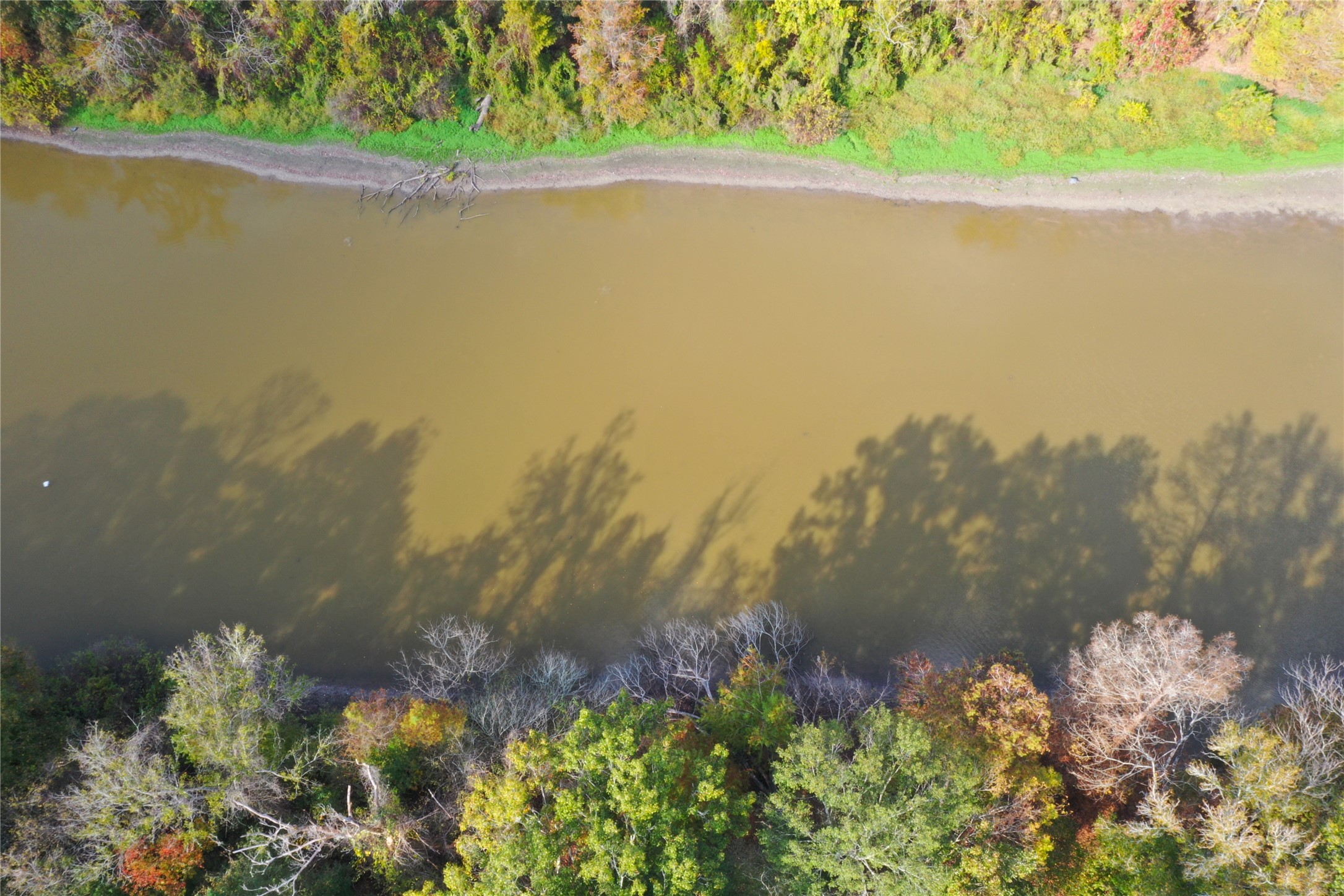 223 County Road 2167B Cleveland, TX 77327 - Photo 47 of 50 a view of a lake with a mountain
