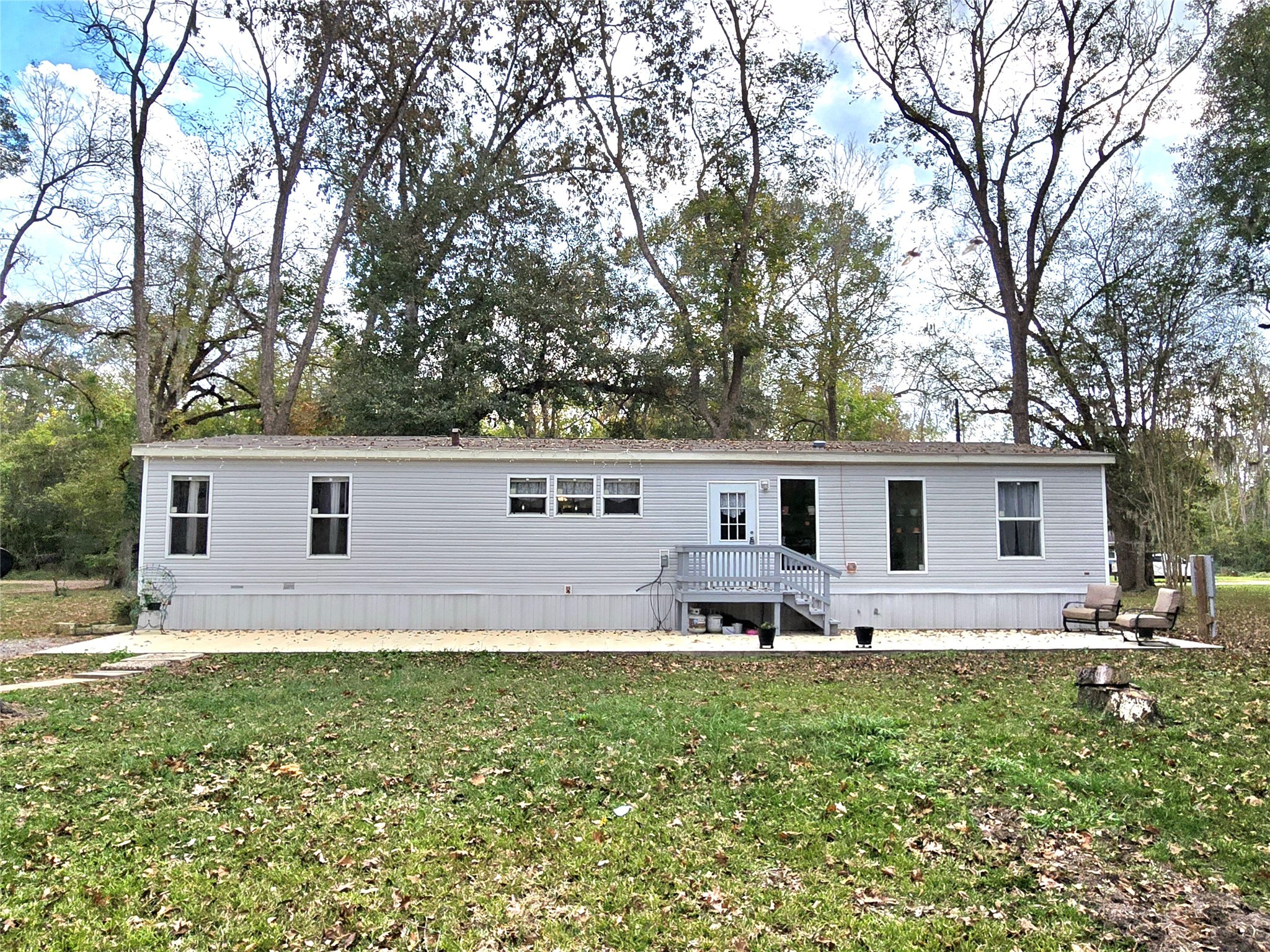 223 County Road 2167B Cleveland, TX 77327 - Photo 5 of 50 a house view with outdoor space and garden