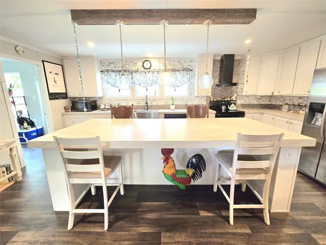 a kitchen with a sink cabinets and window