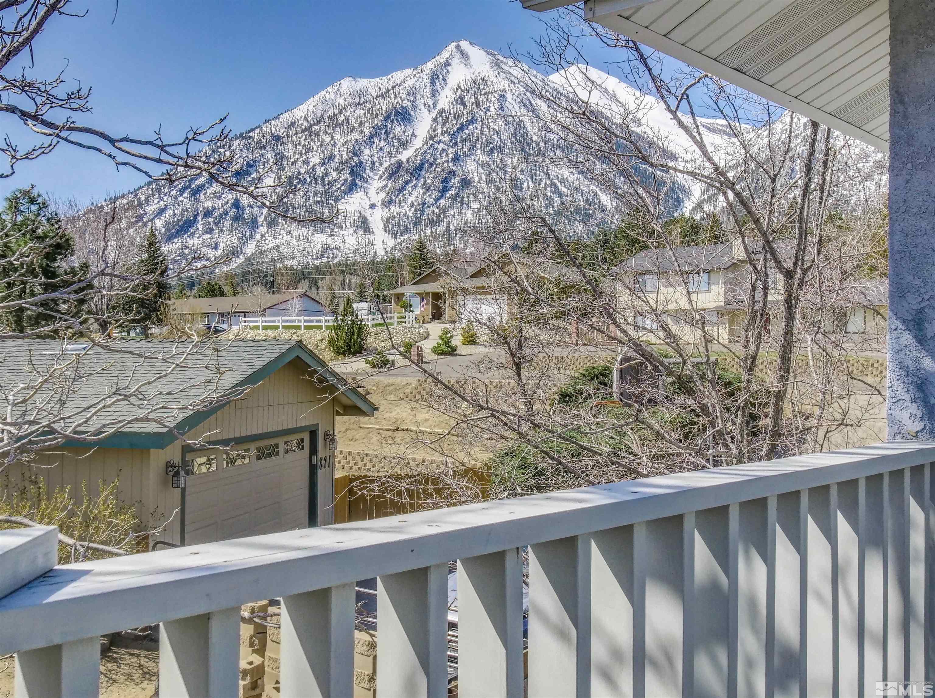 875 Bollen Circle Gardnerville, NV 89460 - Photo 15 of 26 a view of a wooden house with a yard