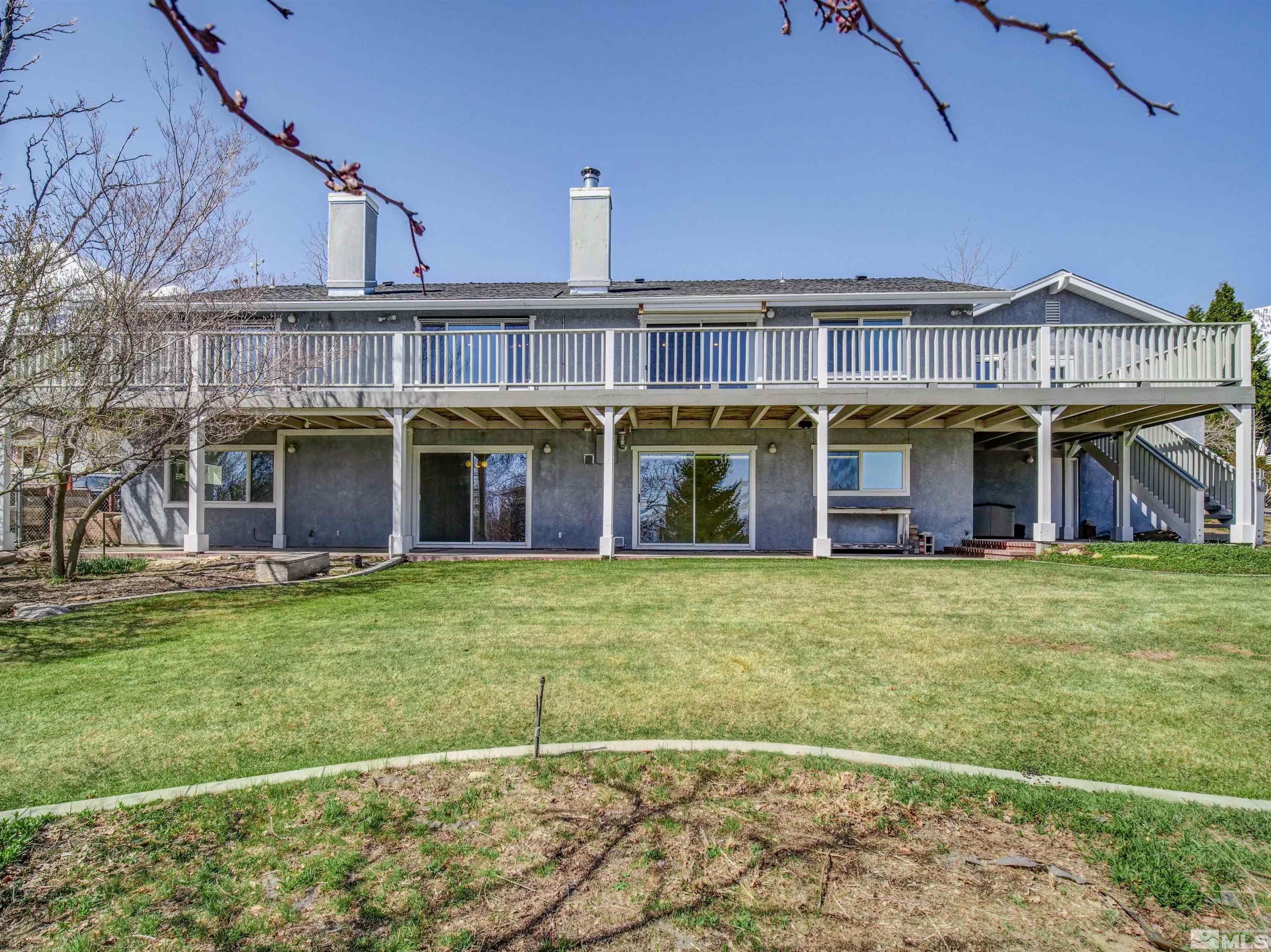 875 Bollen Circle Gardnerville, NV 89460 - Photo 23 of 26 a view of an apartment with a backyard