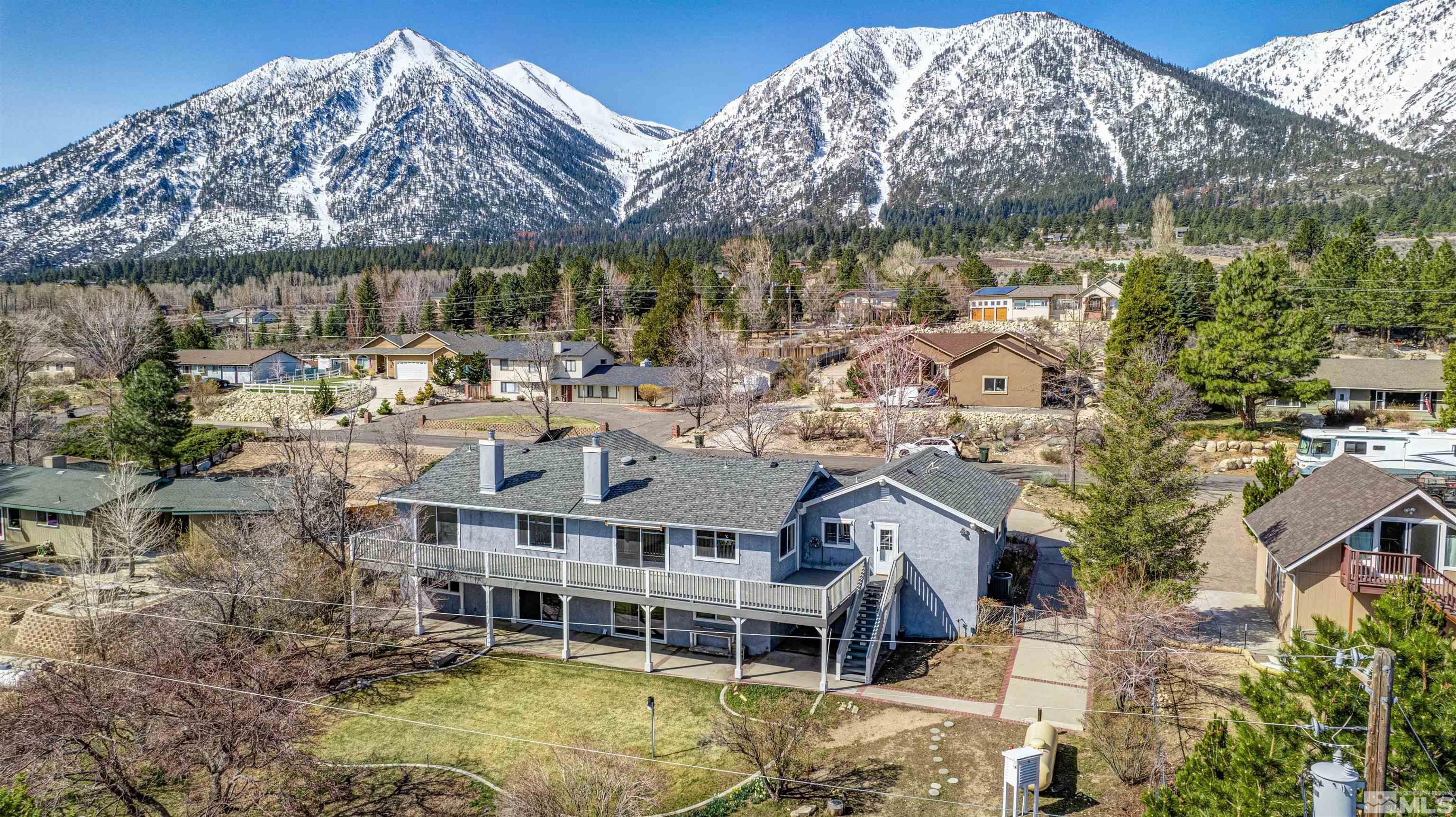 875 Bollen Circle Gardnerville, NV 89460 - Photo 3 of 26 a aerial view of a house with swimming pool garden and patio