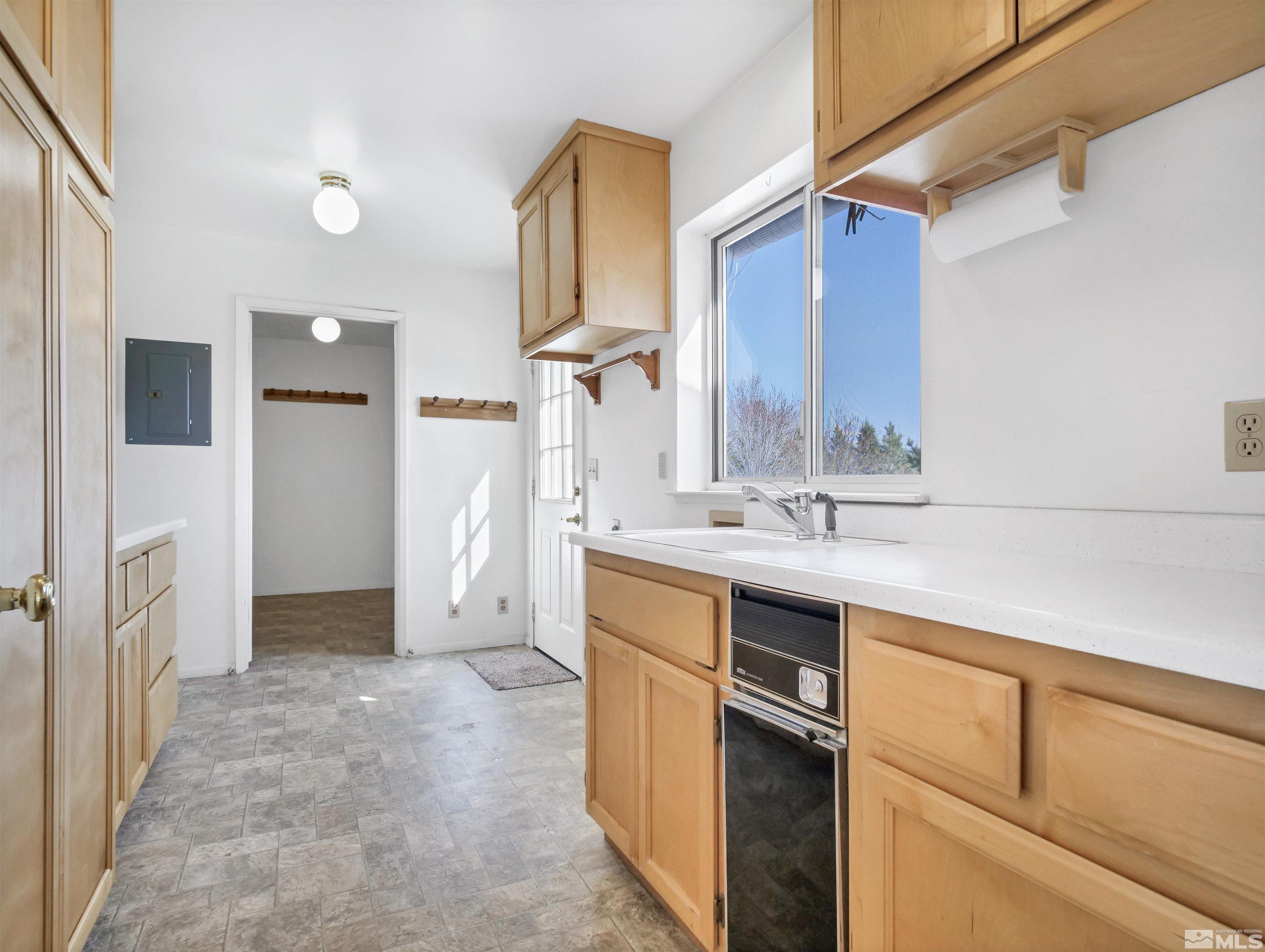 875 Bollen Circle Gardnerville, NV 89460 - Photo 6 of 26 a bathroom with a sink and a mirror