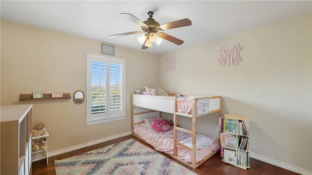 a bedroom with furniture and a window