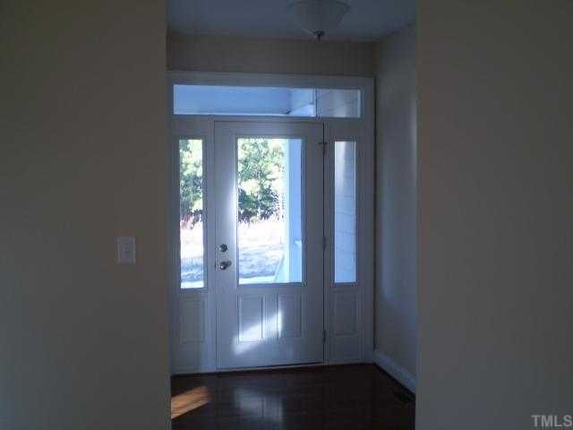 5720 Spring Glen Lane Raleigh, NC 27616 - Photo 4 of 12 Beautiful picture frame front door ,side lites and transom window above door.