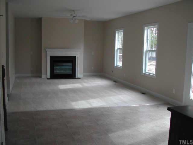 5720 Spring Glen Lane Raleigh, NC 27616 - Photo 8 of 12 Huge Familyroom with gas log fireplace