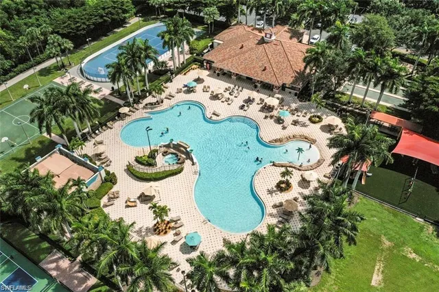 an aerial view of a swimming pool and outdoor space