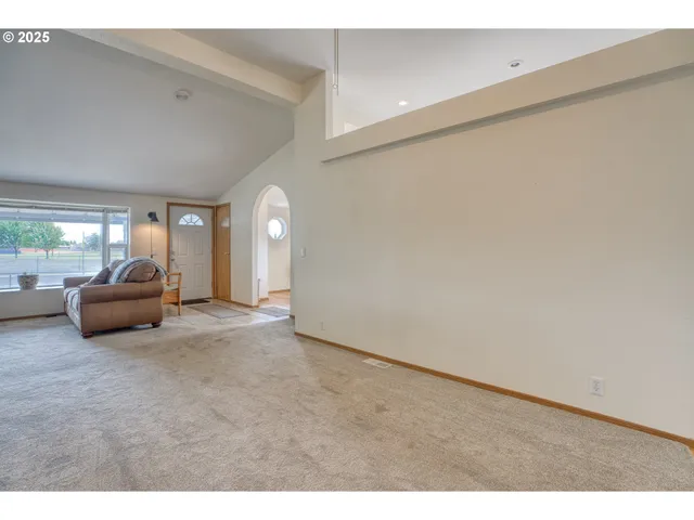 a view of livingroom with furniture and window