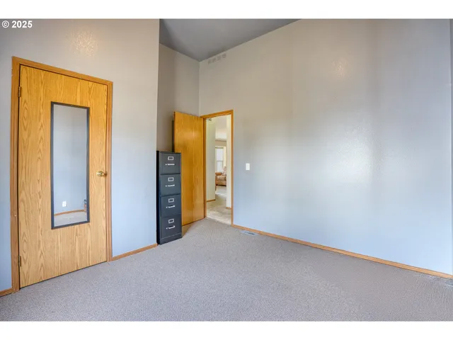 a view of an empty room and window