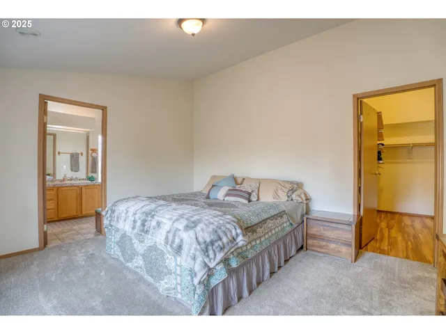 a bedroom with two beds and painted walls