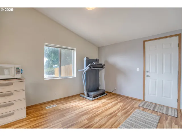 a view of a livingroom with wooden floor and closet