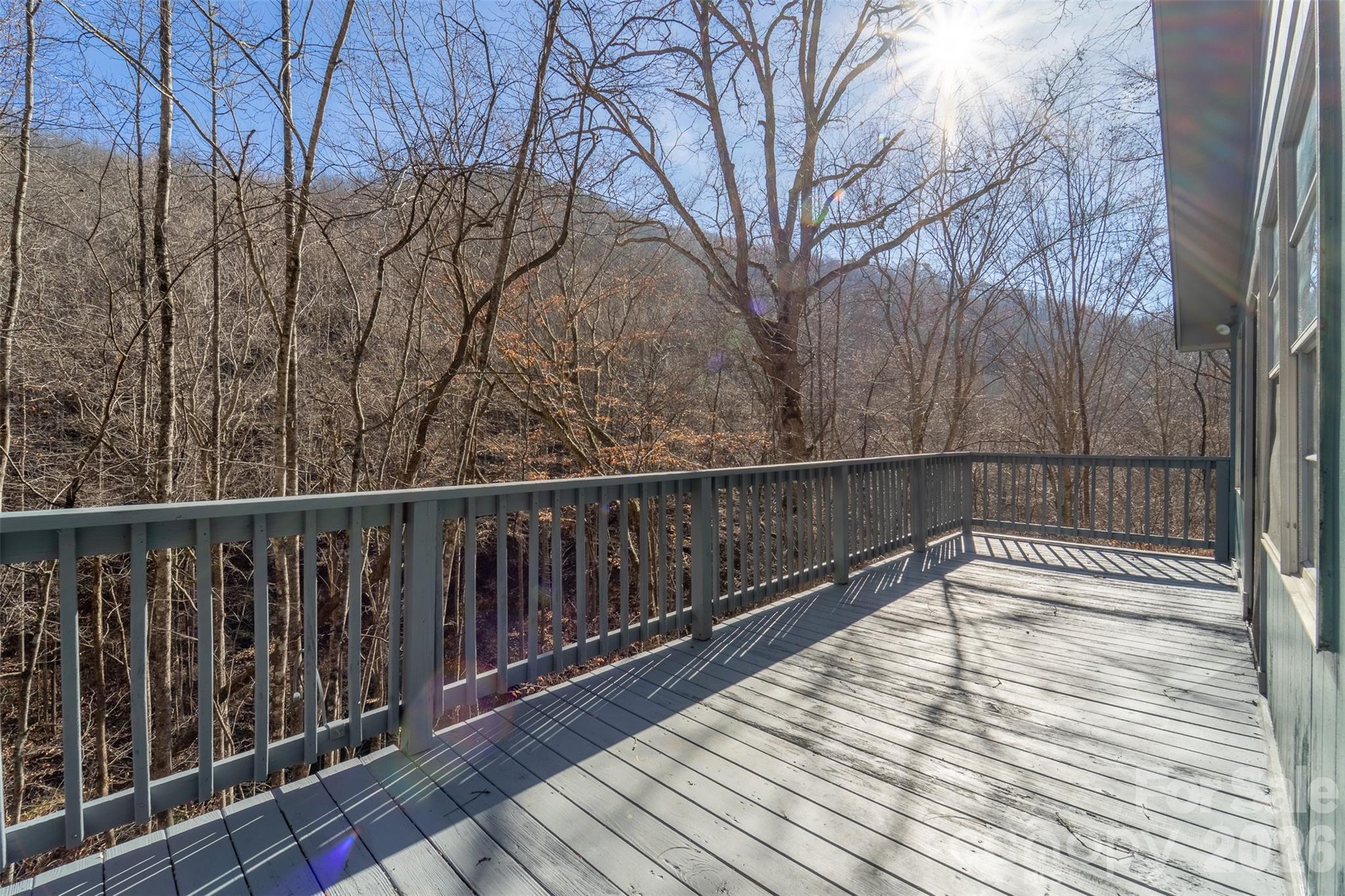744 Coon Creek Road Franklin, NC 28734 - Photo 19 of 21 a view of balcony with wooden floor and fence