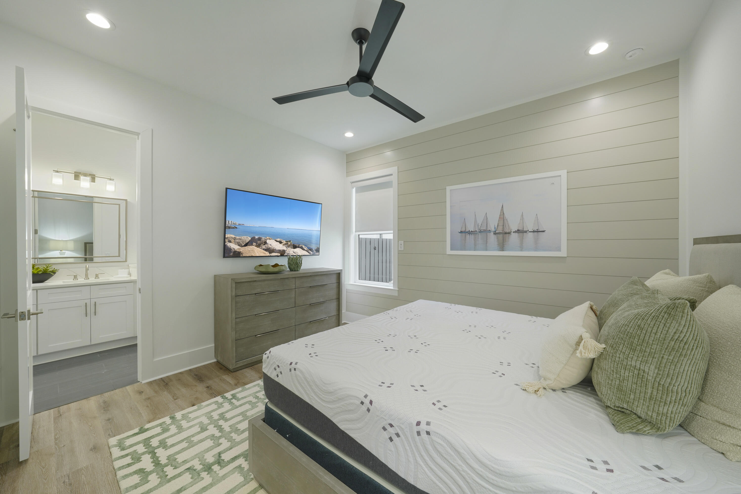 51 Penny Lane Santa Rosa Beach, FL 32459 - Photo 17 of 80 a bedroom with a large bed and a chandelier