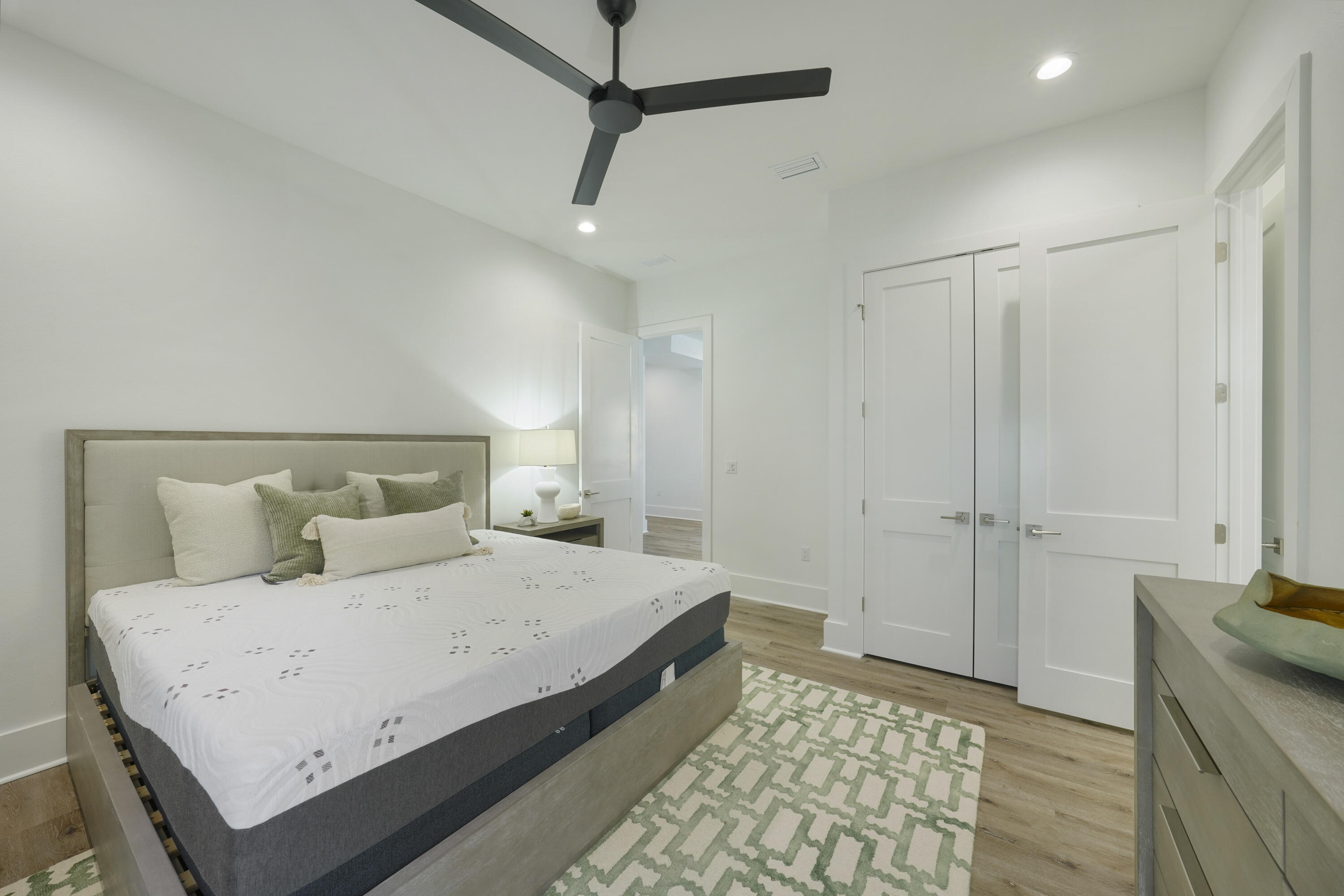 51 Penny Lane Santa Rosa Beach, FL 32459 - Photo 18 of 80 a bedroom with a large bed and a chandelier