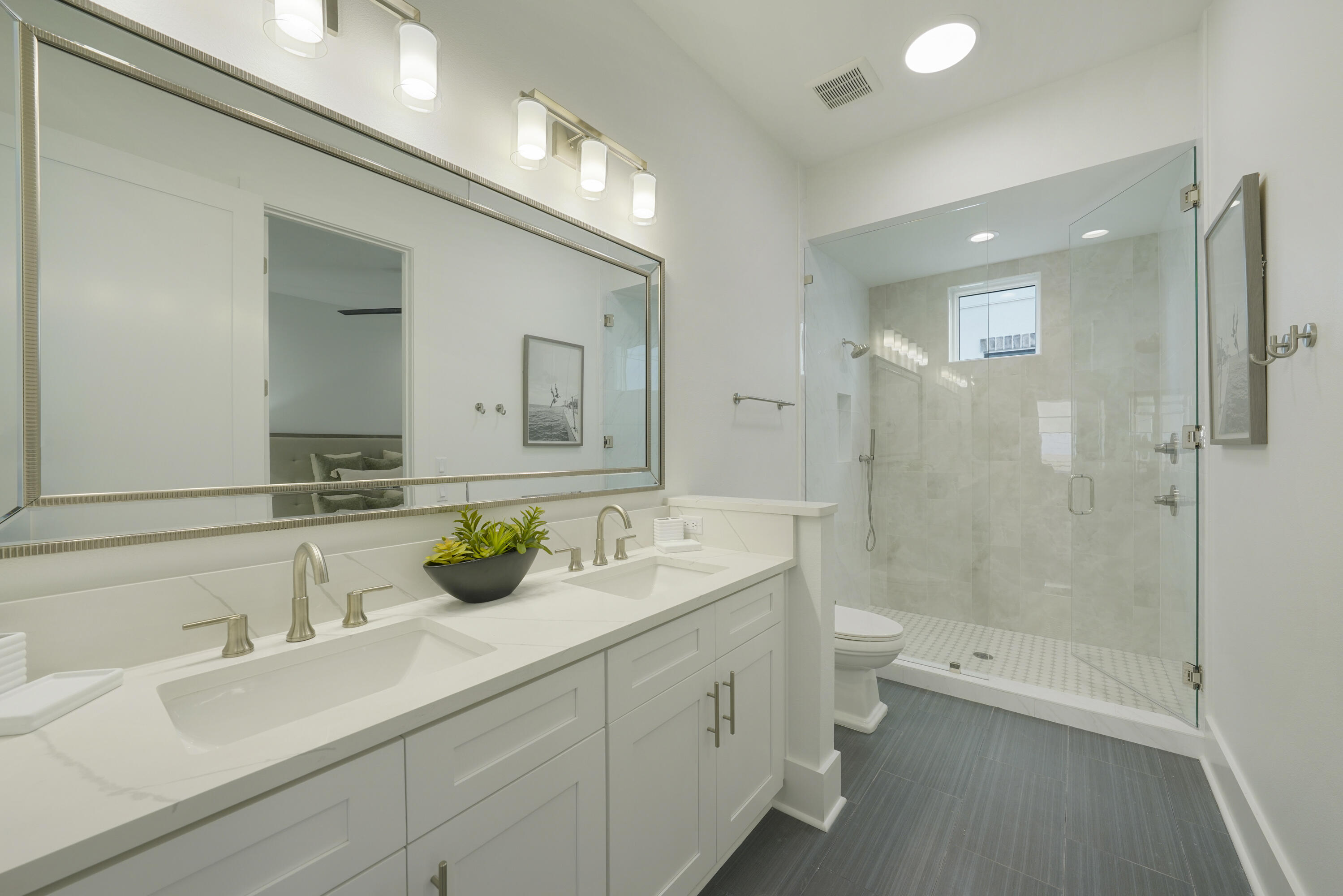 51 Penny Lane Santa Rosa Beach, FL 32459 - Photo 19 of 80 a bathroom with a double vanity sink toilet and shower