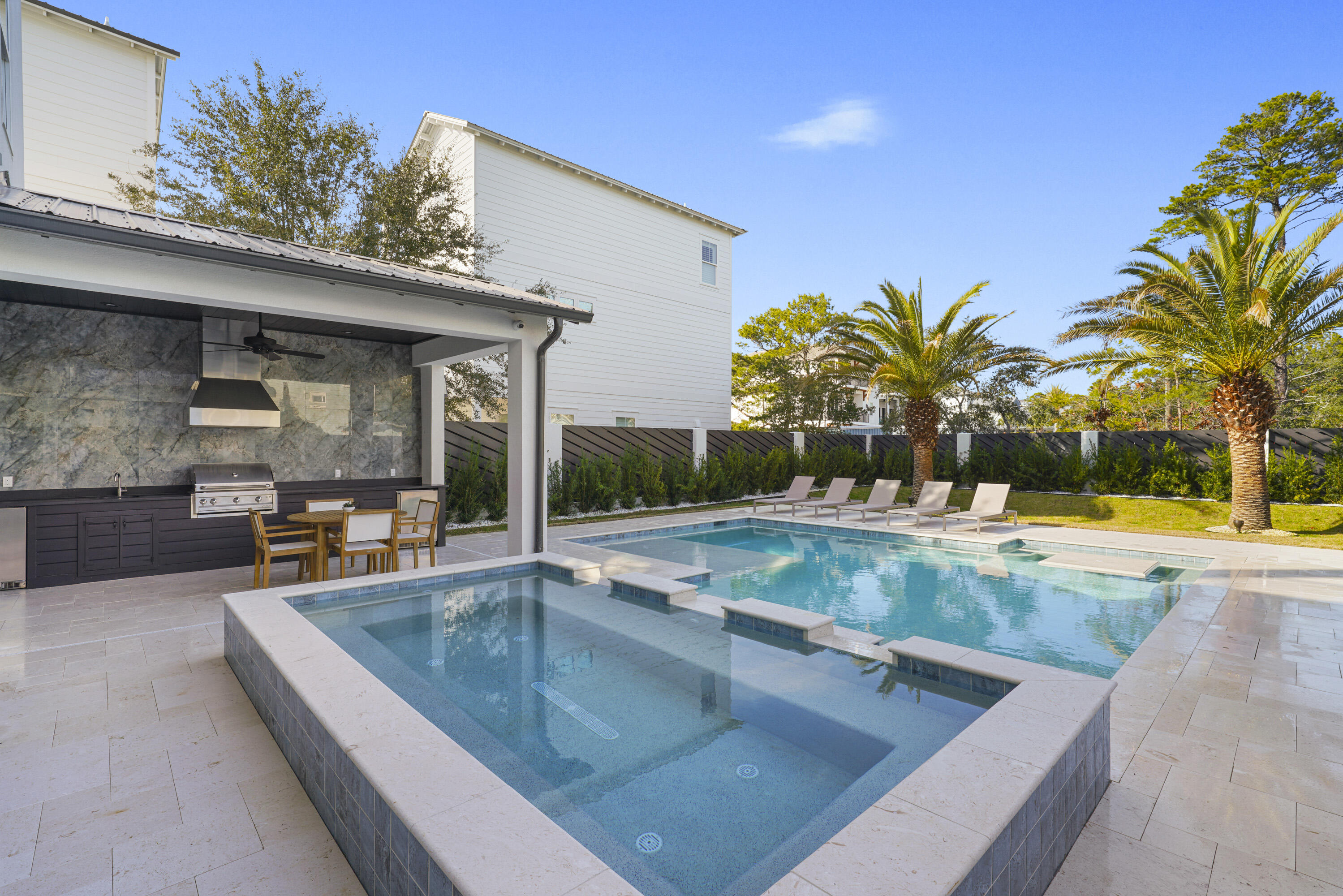 51 Penny Lane Santa Rosa Beach, FL 32459 - Photo 23 of 80 a view of a swimming pool with a lounge chair