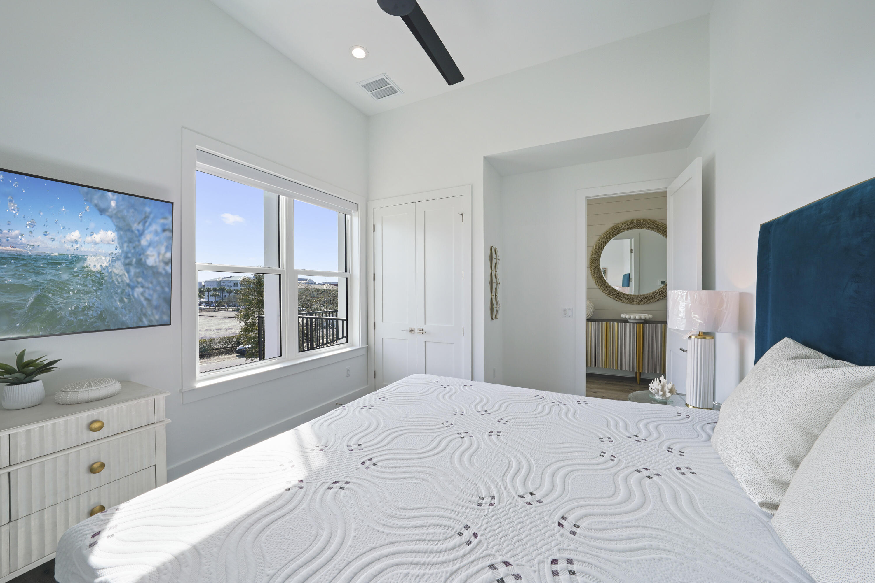 51 Penny Lane Santa Rosa Beach, FL 32459 - Photo 31 of 80 a bedroom with a large bed and a flat tv screen on dresser