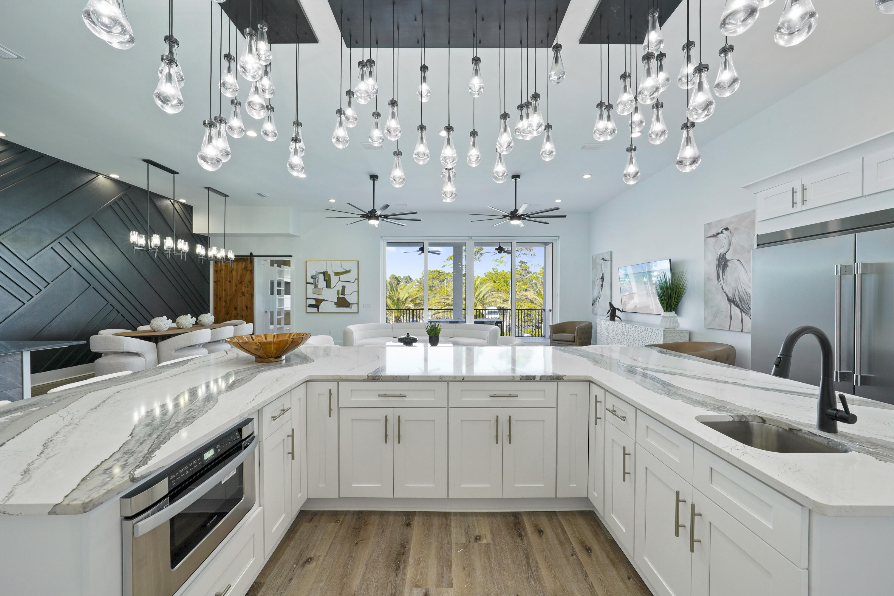 51 Penny Lane Santa Rosa Beach, FL 32459 - Photo 42 of 80 a kitchen with a sink stove and cabinets