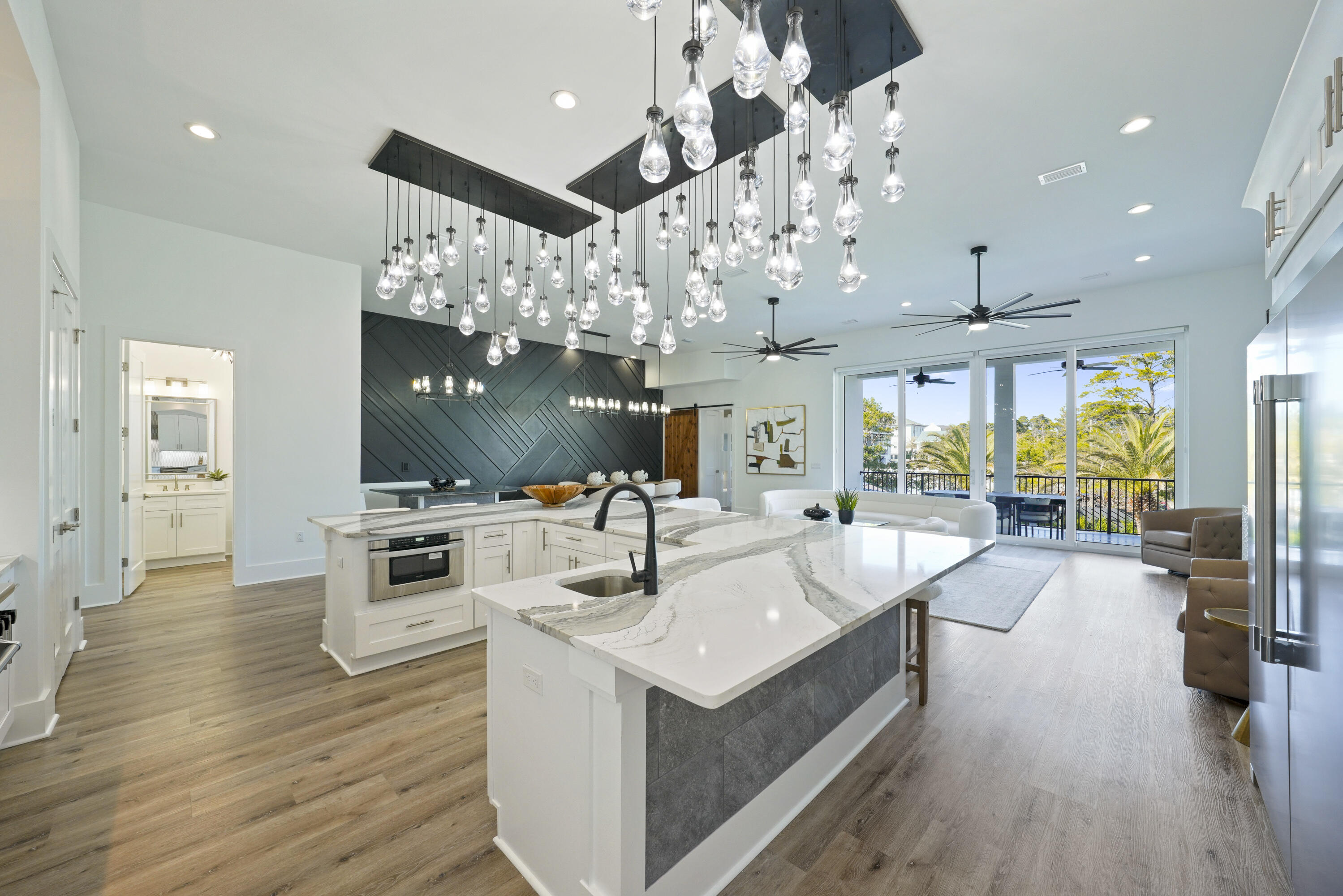 51 Penny Lane Santa Rosa Beach, FL 32459 - Photo 43 of 80 a large white kitchen with a large island in the center