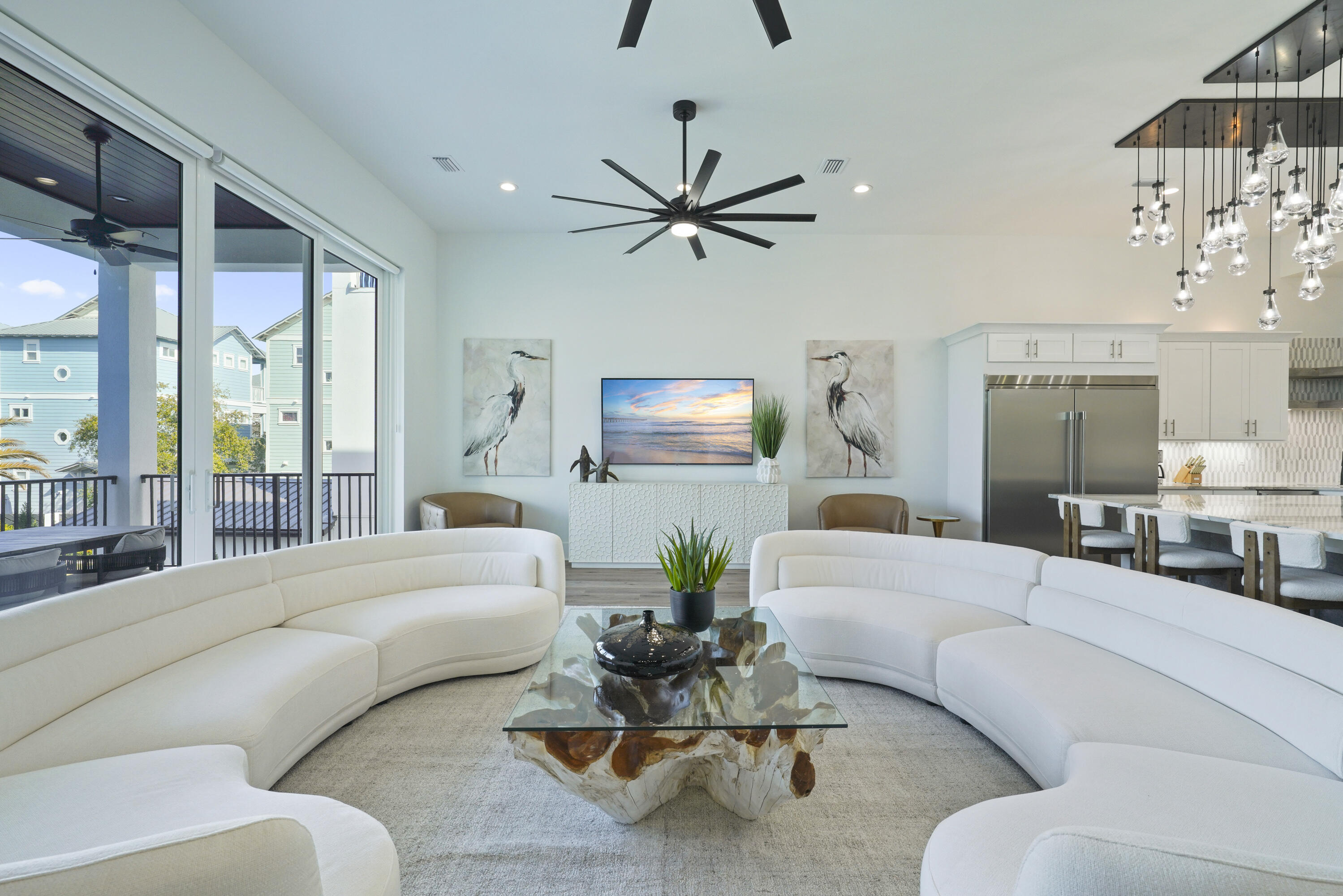 51 Penny Lane Santa Rosa Beach, FL 32459 - Photo 49 of 80 a living room with furniture a large window and a chandelier