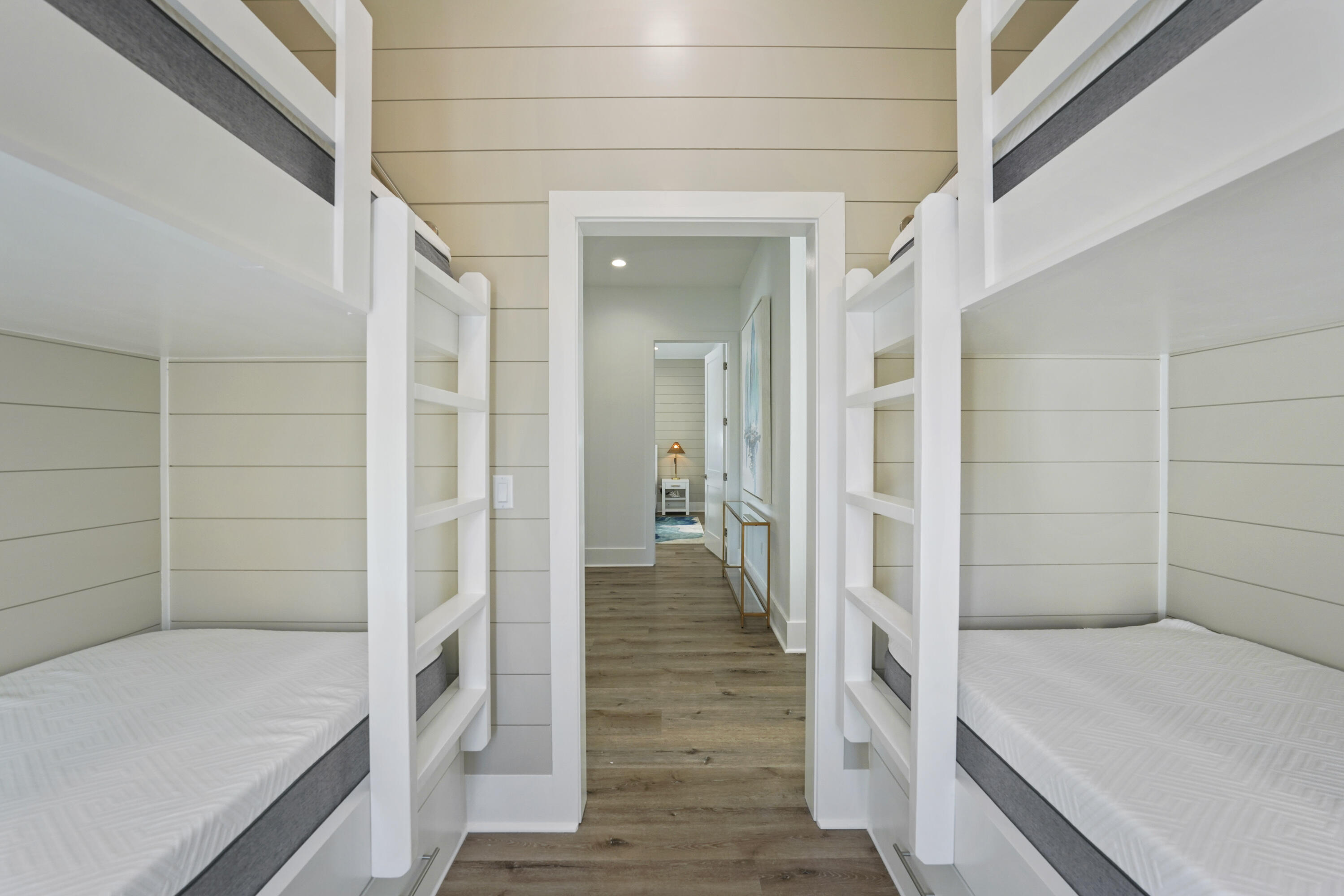 51 Penny Lane Santa Rosa Beach, FL 32459 - Photo 55 of 80 a view of a hallway with wooden floor and staircase