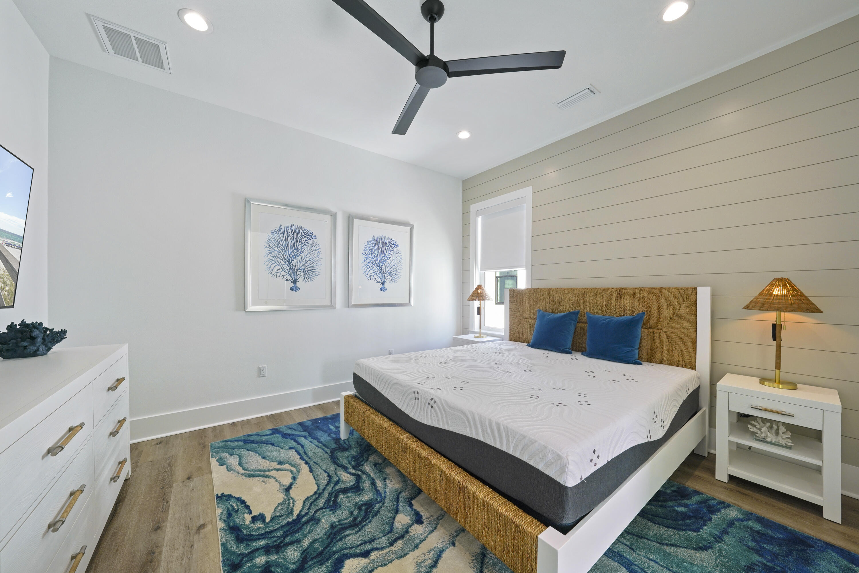 51 Penny Lane Santa Rosa Beach, FL 32459 - Photo 57 of 80 a bedroom with a bed a dresser and potted plants