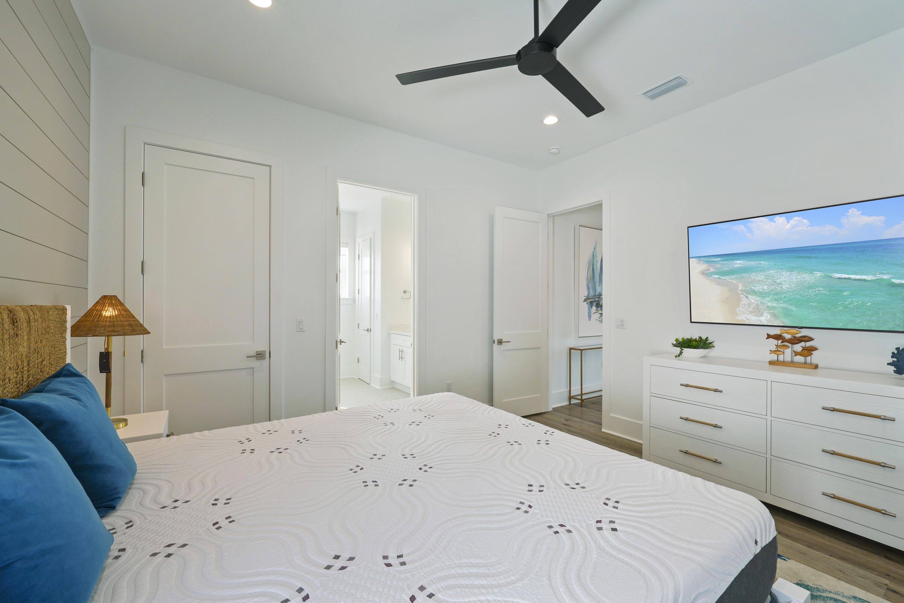 51 Penny Lane Santa Rosa Beach, FL 32459 - Photo 59 of 80 a bedroom with a bed and a flat tv screen