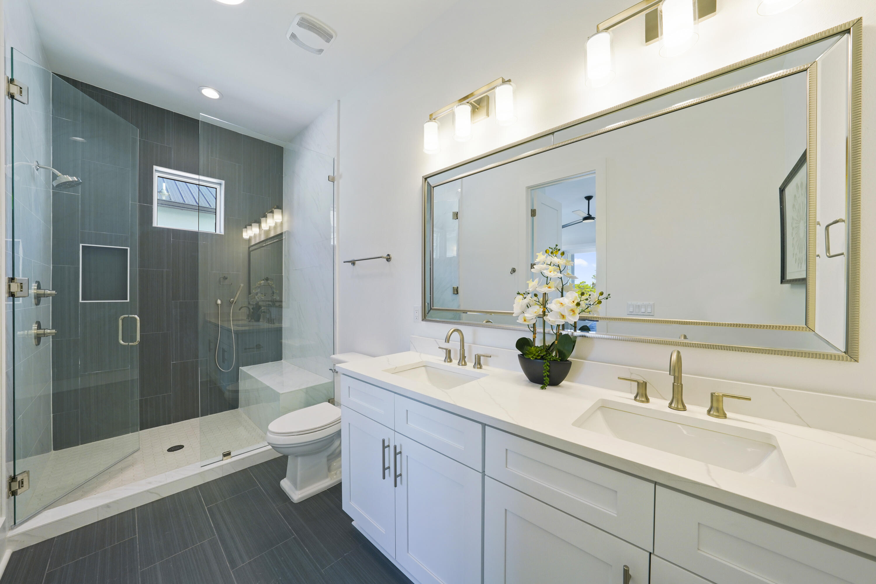 51 Penny Lane Santa Rosa Beach, FL 32459 - Photo 64 of 80 a bathroom with a double vanity sink toilet mirror and shower