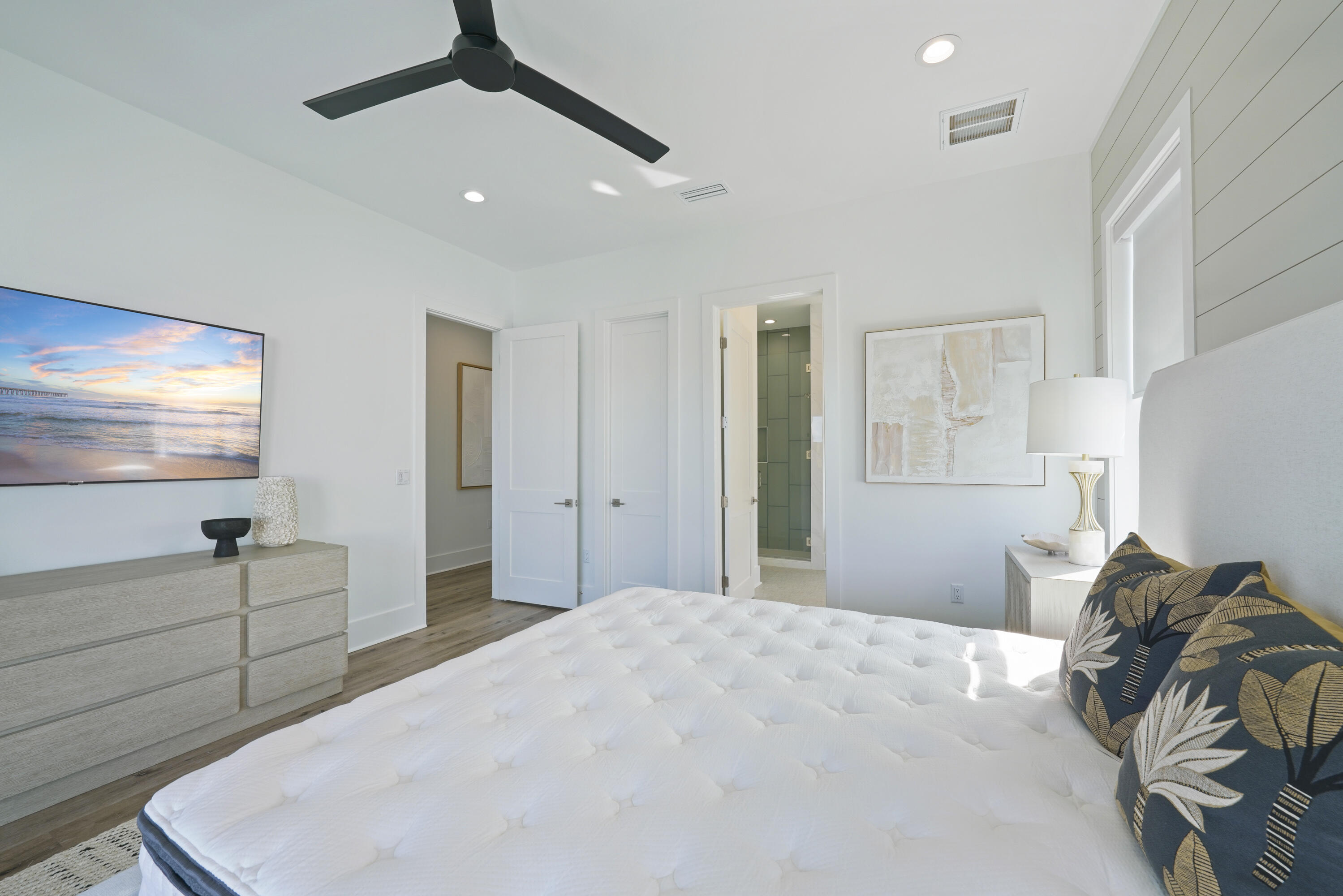 51 Penny Lane Santa Rosa Beach, FL 32459 - Photo 67 of 80 a bedroom with a bed and a chandelier