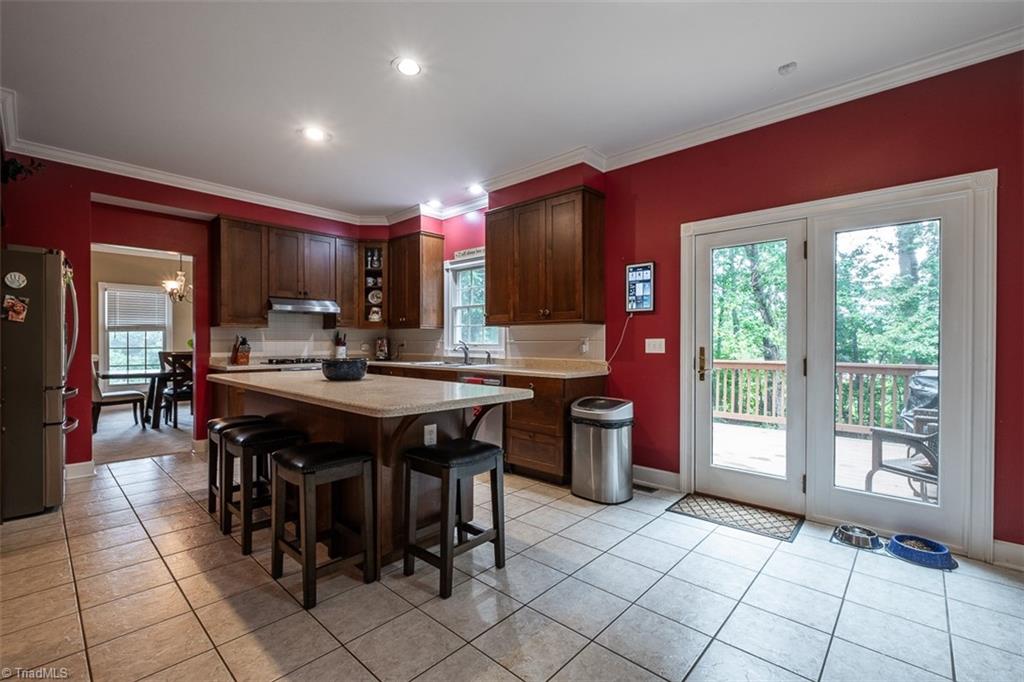 328 Laurelwood Road State Road, NC 28676 - Photo 11 of 39 Kitchen with tile floor and French doors leading to back deck.
