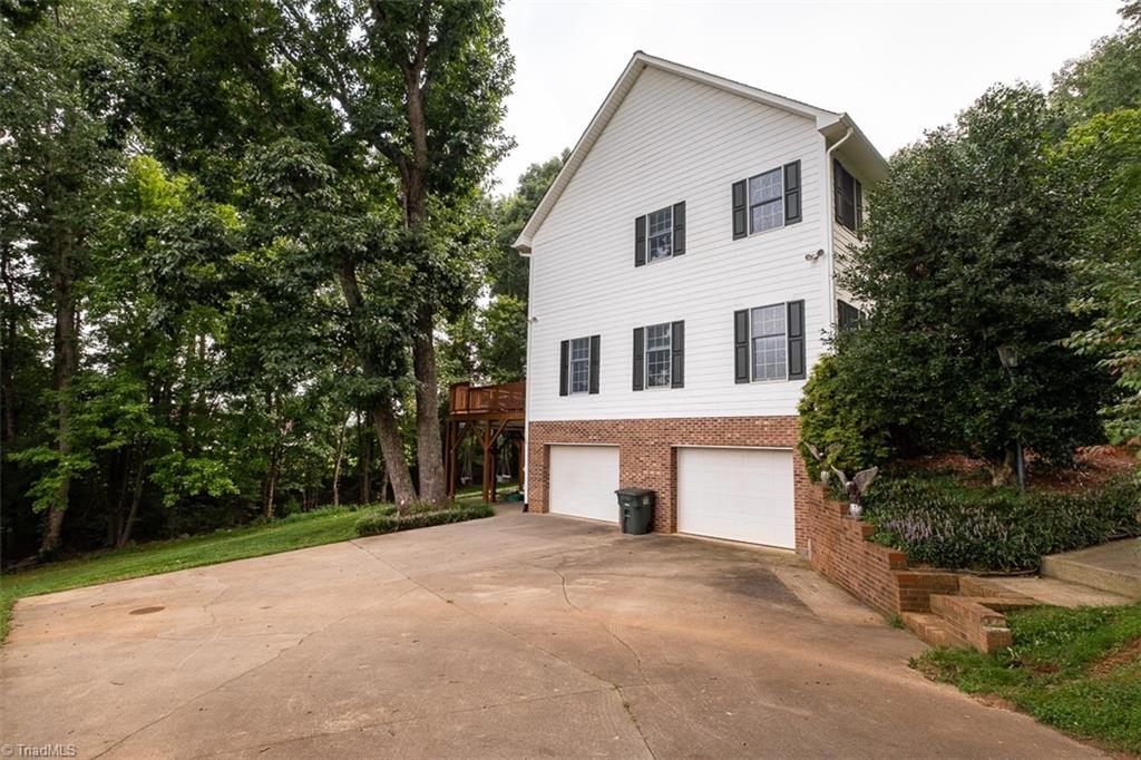 Side view of home with driveway and two door garage.