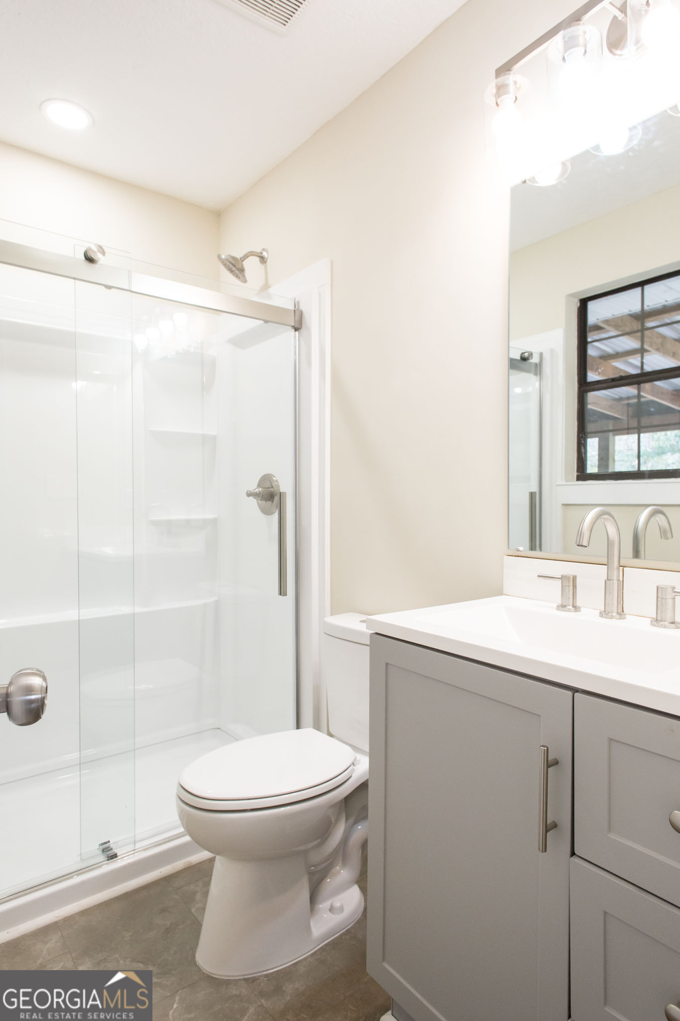 407 Pineview Drive Waycross, GA 31501 - Photo 26 of 35 a bathroom with a sink a toilet and shower