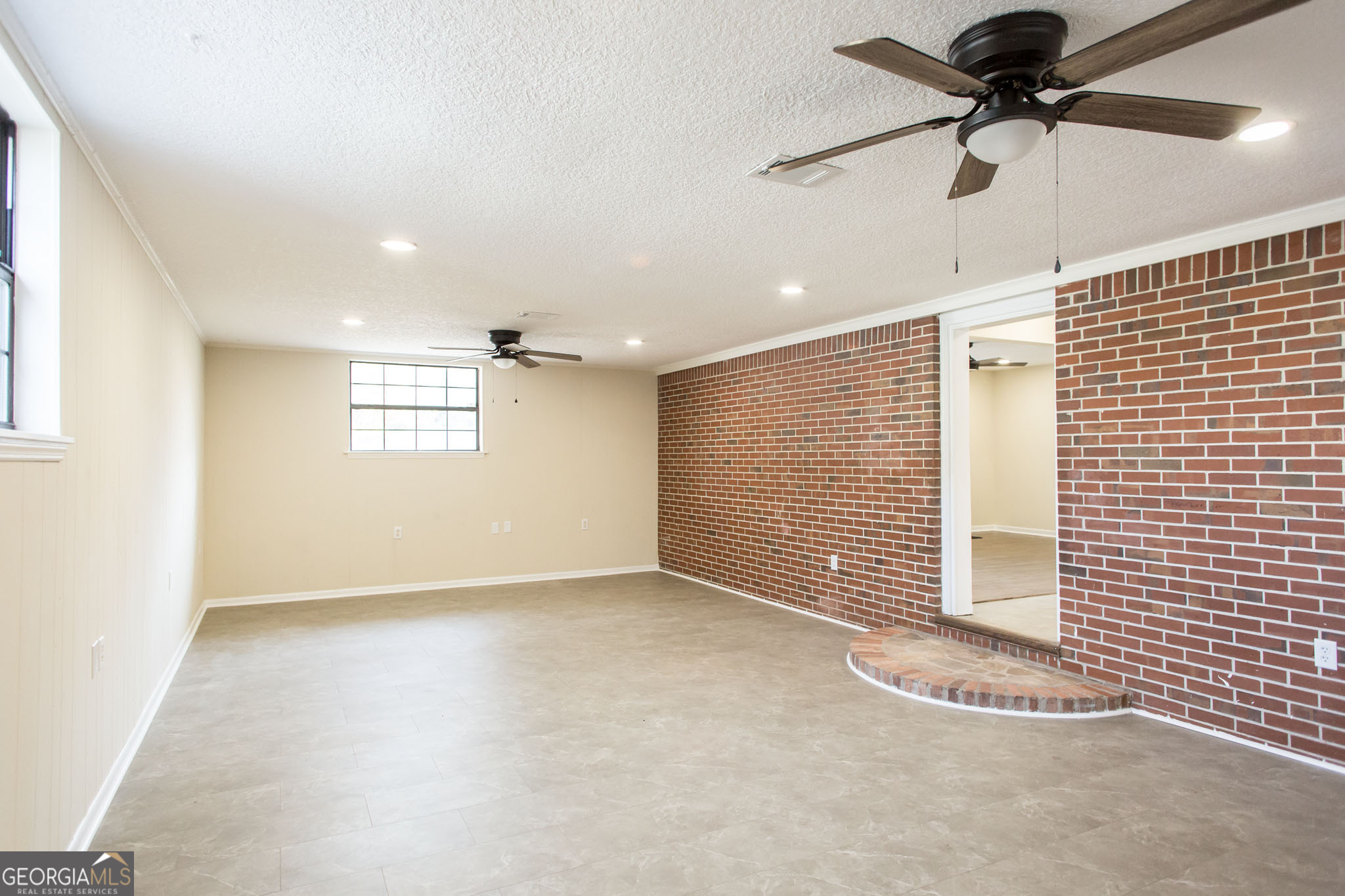 407 Pineview Drive Waycross, GA 31501 - Photo 10 of 35 a view of an empty room with a window