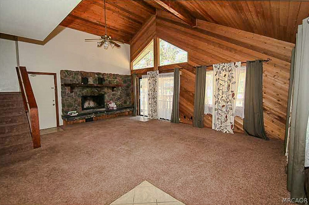 337 Maple Lane Sugarloaf, CA 92386 - Photo 8 of 25 a view of empty room with wooden floor and fan