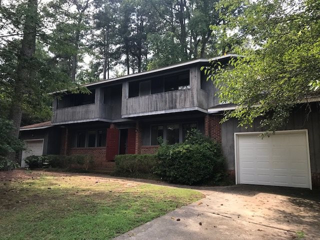 7209 Harps Mill Road Raleigh, NC 27615 - Photo 1 of 13 a house with a tree in front of it