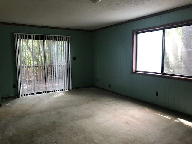 7209 Harps Mill Road Raleigh, NC 27615 - Photo 6 of 13 an empty room with a window