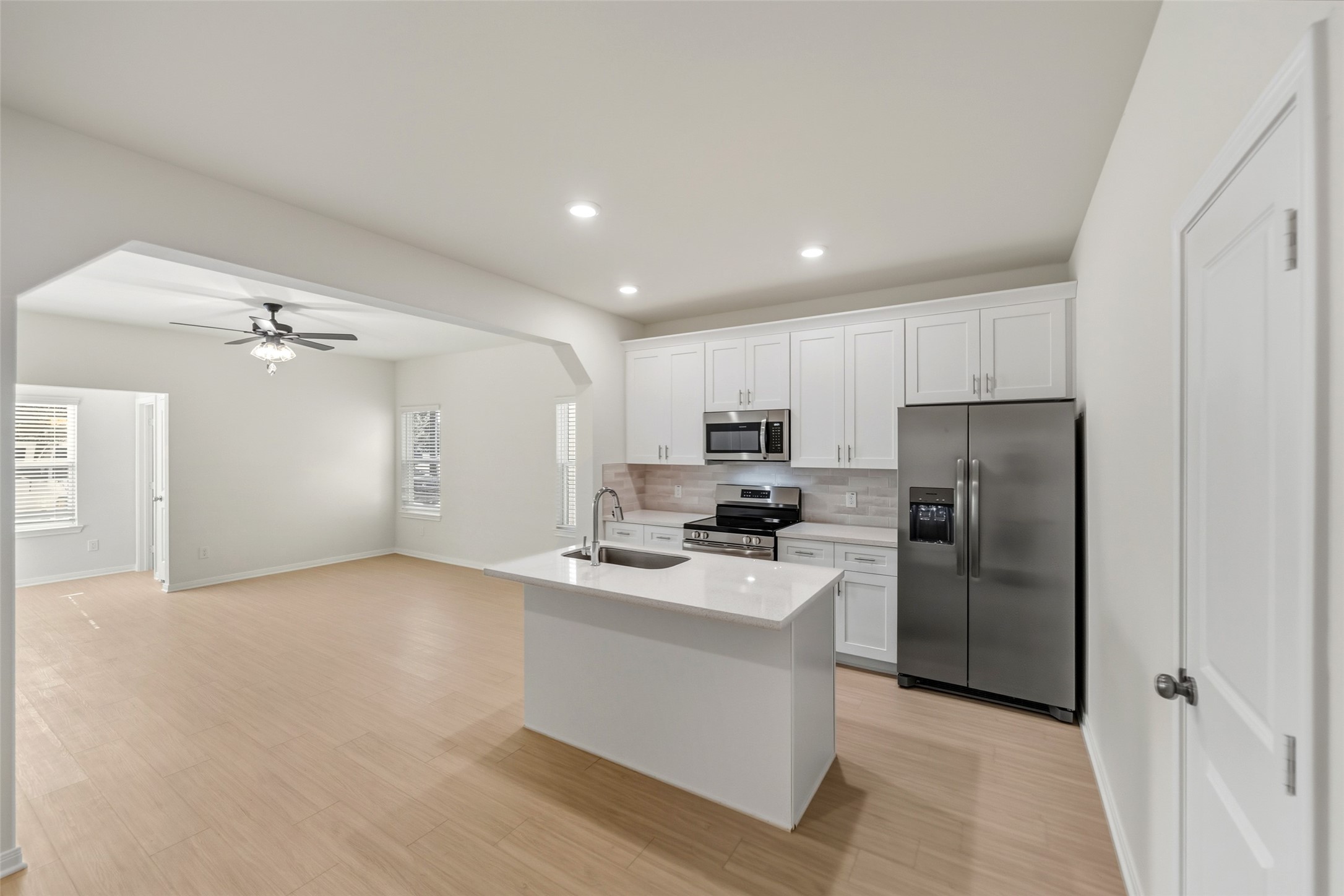 712 West Dallas Street Conroe, TX 77301 - Photo 11 of 23 a kitchen with stainless steel appliances a refrigerator sink and stove