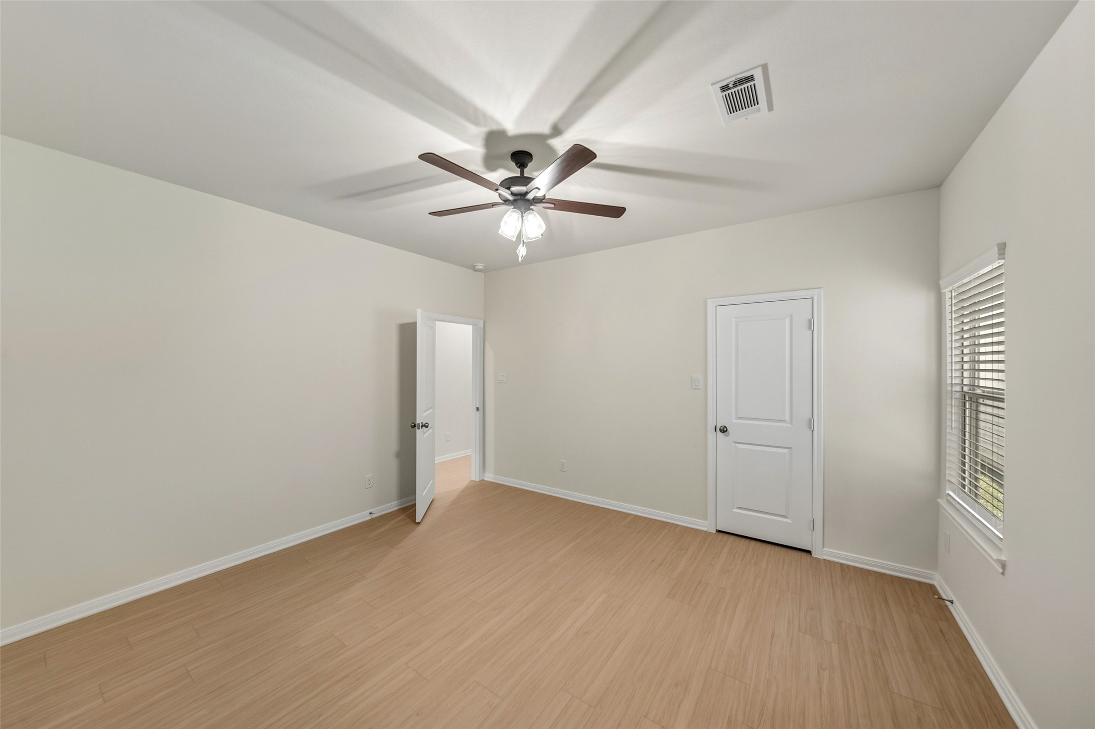 712 West Dallas Street Conroe, TX 77301 - Photo 15 of 23 an empty room with chandelier fan and windows