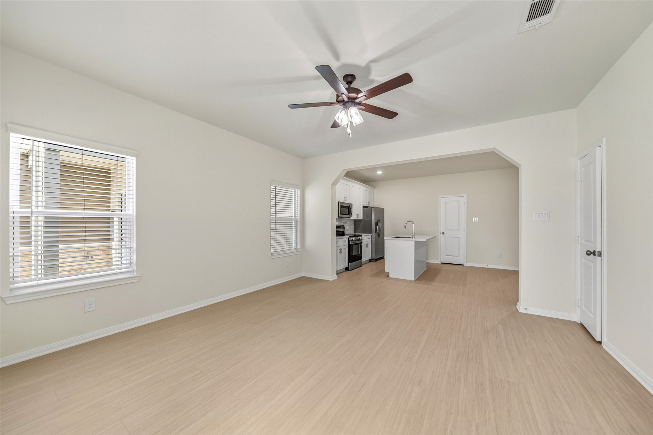 712 West Dallas Street Conroe, TX 77301 - Photo 3 of 23 a view of a livingroom with a ceiling fan and window
