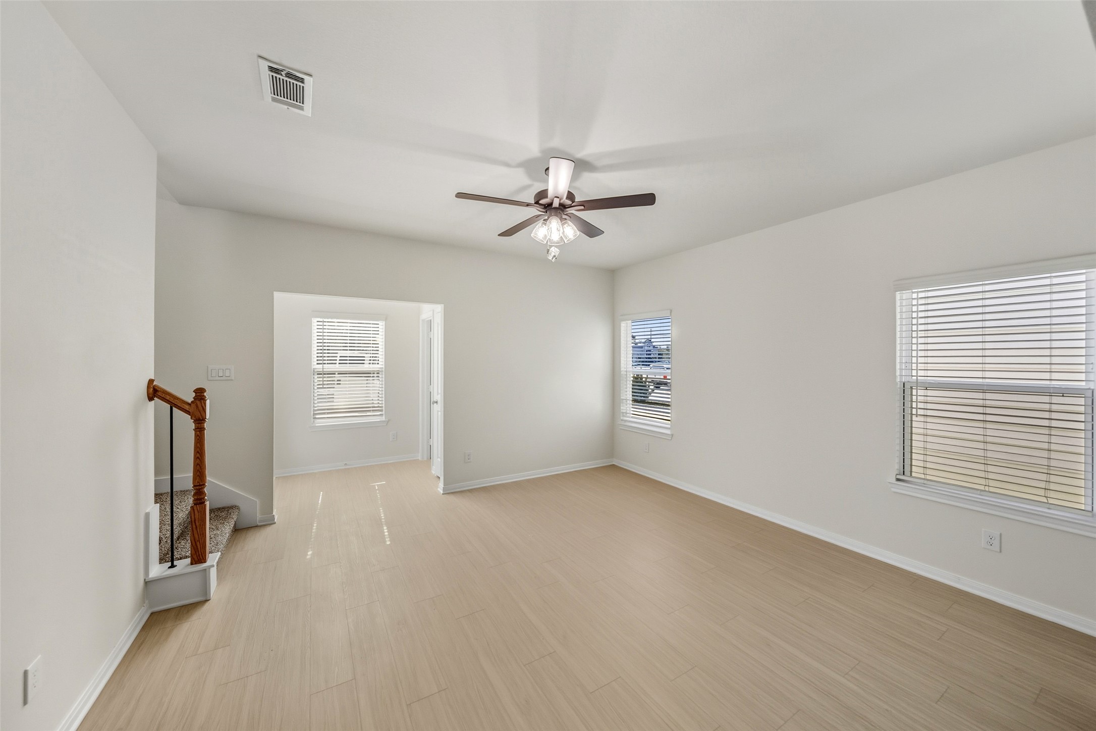 712 West Dallas Street Conroe, TX 77301 - Photo 6 of 23 an empty room with windows and fan